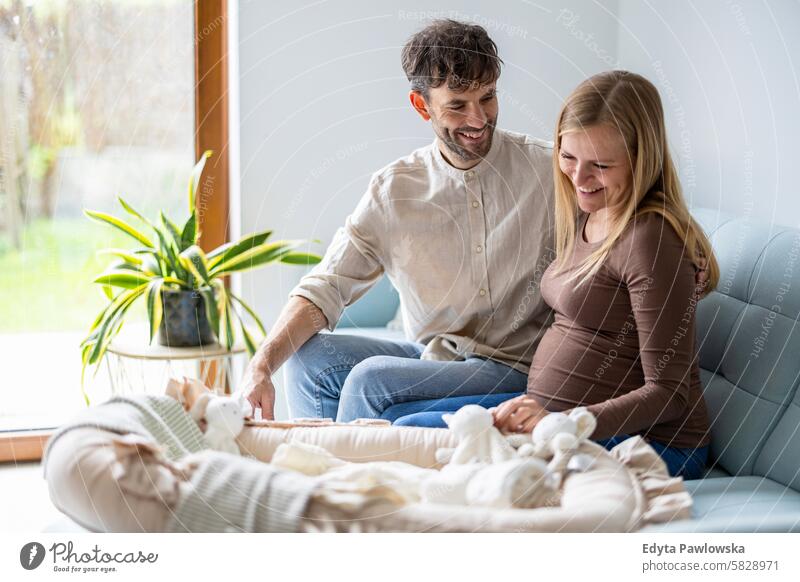 Portrait of a loving couple expecting a baby pregnancy pregnant adult anticipation awaiting belly birth body care caucasian child expectant expectation family