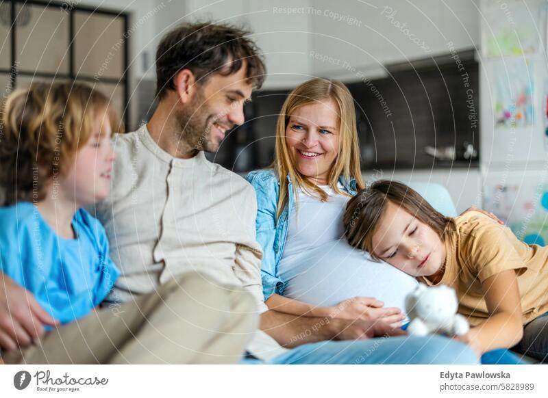 Young family waiting for the new baby pregnancy pregnant adult anticipation awaiting belly birth body care child expectant expecting expectation health