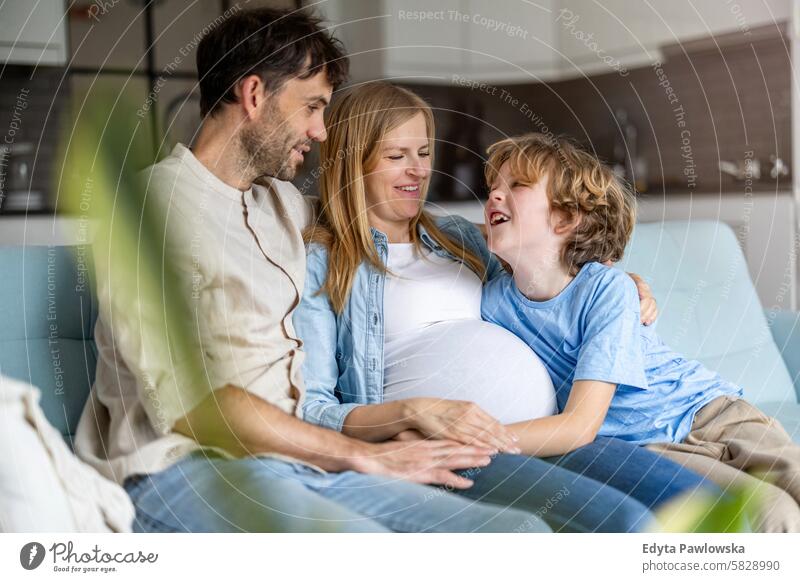 Young family waiting for the new baby pregnancy pregnant adult anticipation awaiting belly birth body care child expectant expecting expectation health