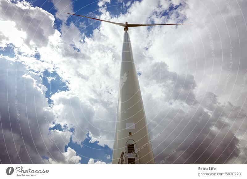 Windmill, large wind power turbine spinning to generating clean renewable energy Aerial Alternative Clean Cloud Cloudy Eco Ecological Ecology Efficiency