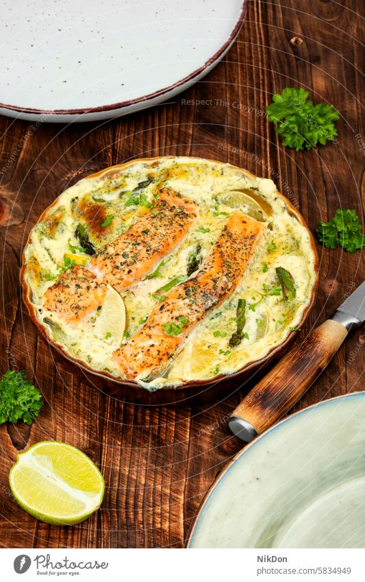 Salmon casserole or gratin on wooden background. fish salmon casserole vegetable lunch salmon gratin fish casserole herb color image no people protein
