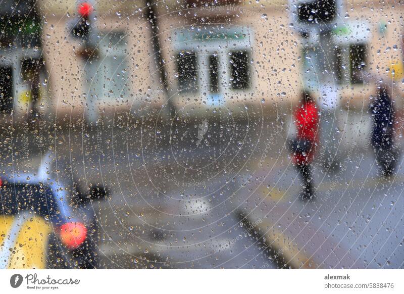 it's raining behind the window drop glass wet jet downpour it is raining it rains drip nature weather outdoor cars outside cold auto autumn transparent