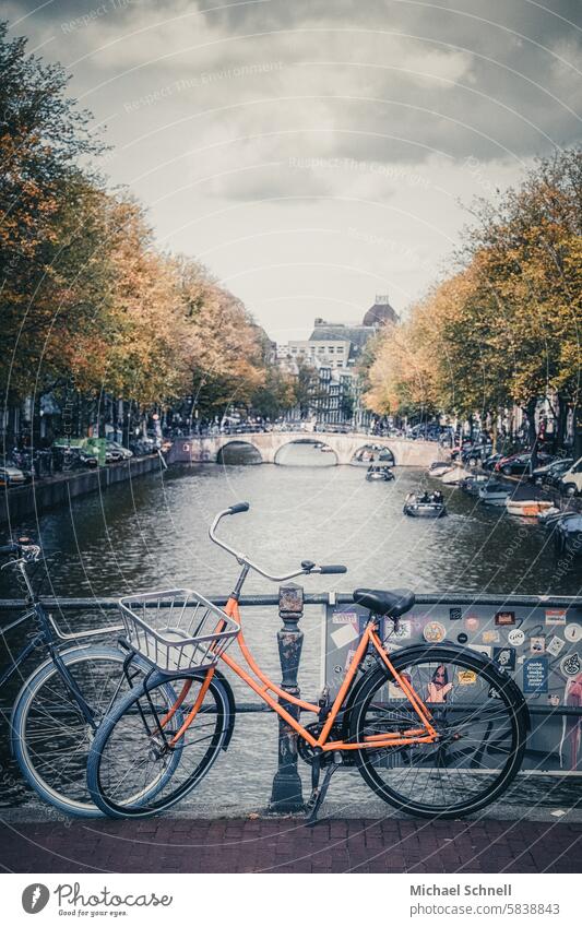 Typical Amsterdam: view of bicycles and a canal Bicycle Gracht Netherlands Colour photo Tourism Vacation & Travel boat boats Water Channel Peaceful