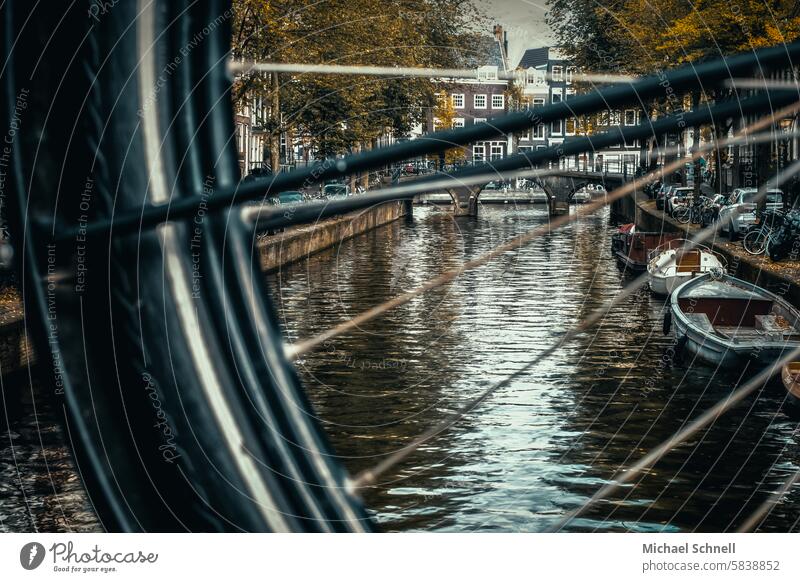 View through a bicycle wheel: canal in Amsterdam Bicycle Gracht Netherlands Colour photo Tourism Vacation & Travel boat boats Water Channel Peaceful