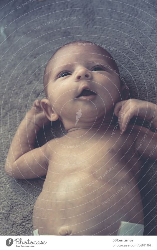 Sweet baby lies and looks dreamy in the air Luxury Elegant Happy Playing Baby Body 1 Human being 0 - 12 months Swimming & Bathing Listening Crawl Laughter Lie