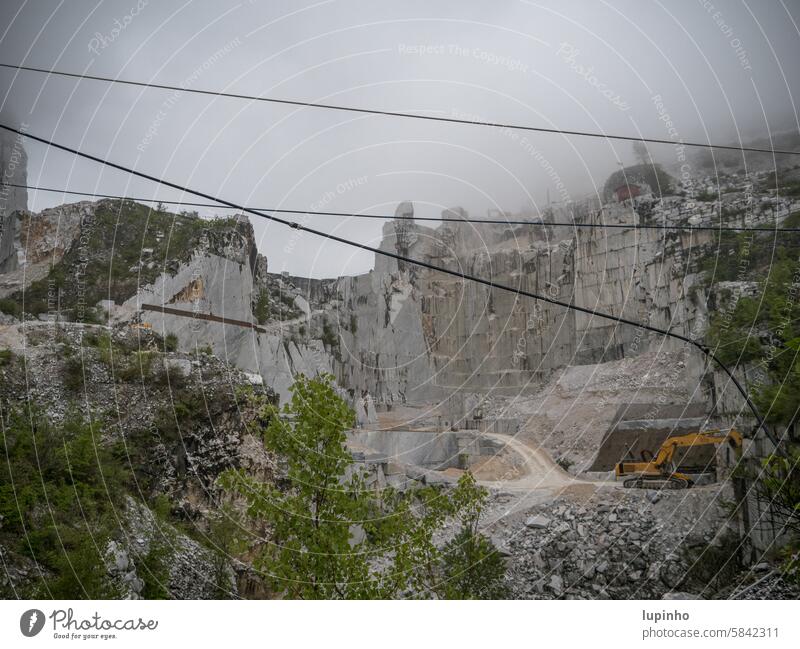 Cararra quarry Quarry Rainy weather cloudy Gray Excavator marble work Italy Tuscany mountain Nature Marble blocks apuan alps stone vacation travel Exterior shot