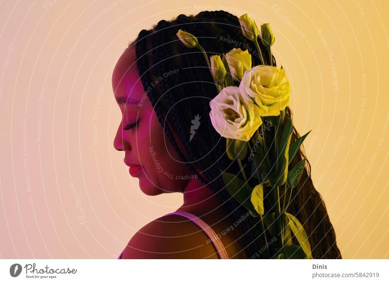 Calm Black woman with white roses in braided hair flower bloom romantic beauty blossom calm jump pink tender present birthday portrait face Love hairstyle light