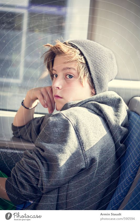 sad or defiant teen sits in a bus Lifestyle Human being Masculine Youth (Young adults) 1 13 - 18 years Child Bus Cap Brunette Observe Discover Sit Dream Sadness