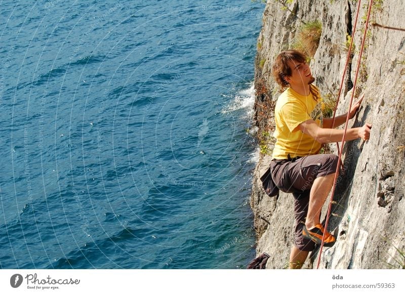 Climbing on Lake Garda Wall (building) Man Rescue Rope Belt Movement Sports Mountain sport climbing Water Blue Climbing rope