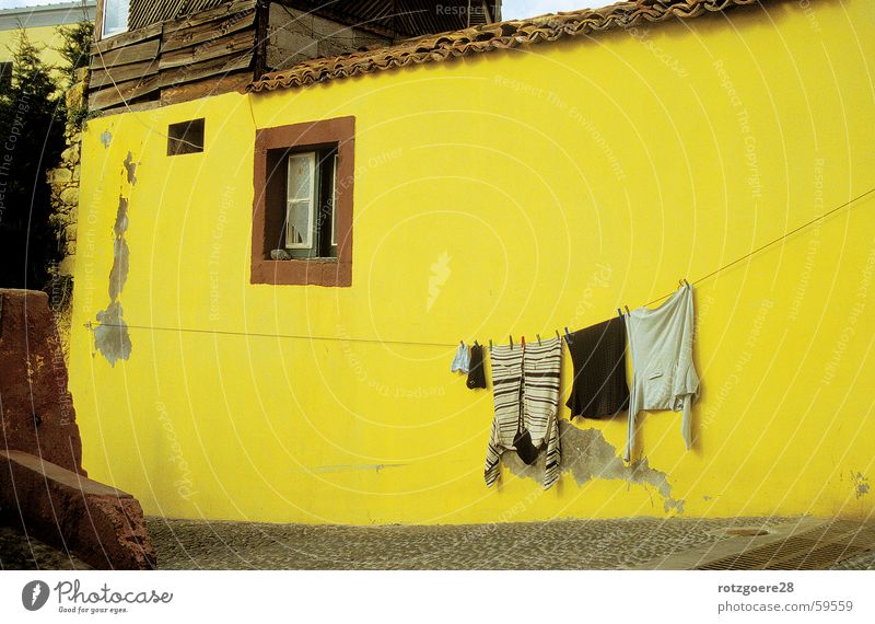 yellow tinge House (Residential Structure) Madeira Yellow Wall (building) Laundry Clothesline Clothing Old Sun Lighting Architecture