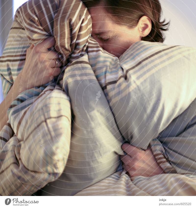 Woman hiding in bedspread Lifestyle Illness Relaxation Calm Living or residing Bed Bedroom Adults 1 Human being 30 - 45 years Bedclothes Duvet To hold on Cuddly