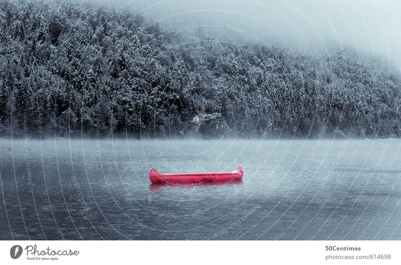 Red canoe in a wintry lake Vacation & Travel Tourism Trip Adventure Freedom Winter Mountain Sports Aquatics Winter sports Environment Nature Landscape