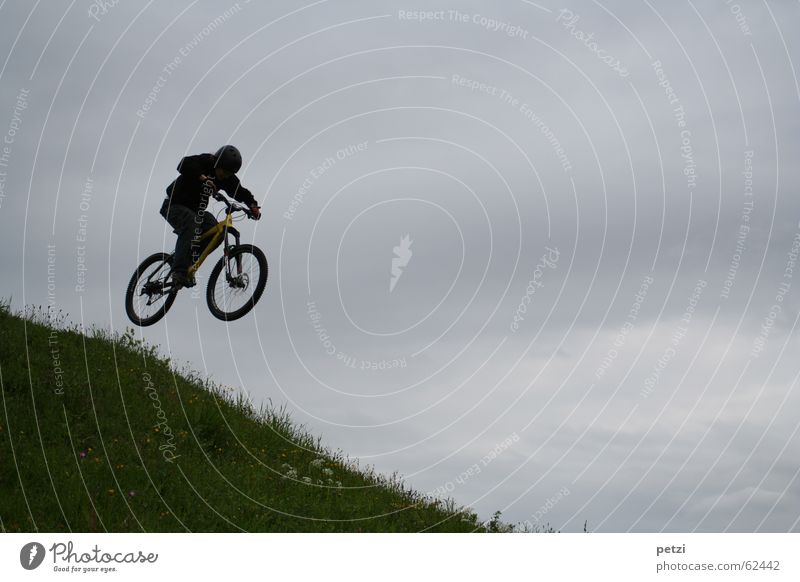 More beautiful than flying... Joy Freedom Bicycle Air Sky Clouds Bad weather Wind Meadow Helmet Flying Jump Speed Brave Concentrate Mountain bike Slope Steep