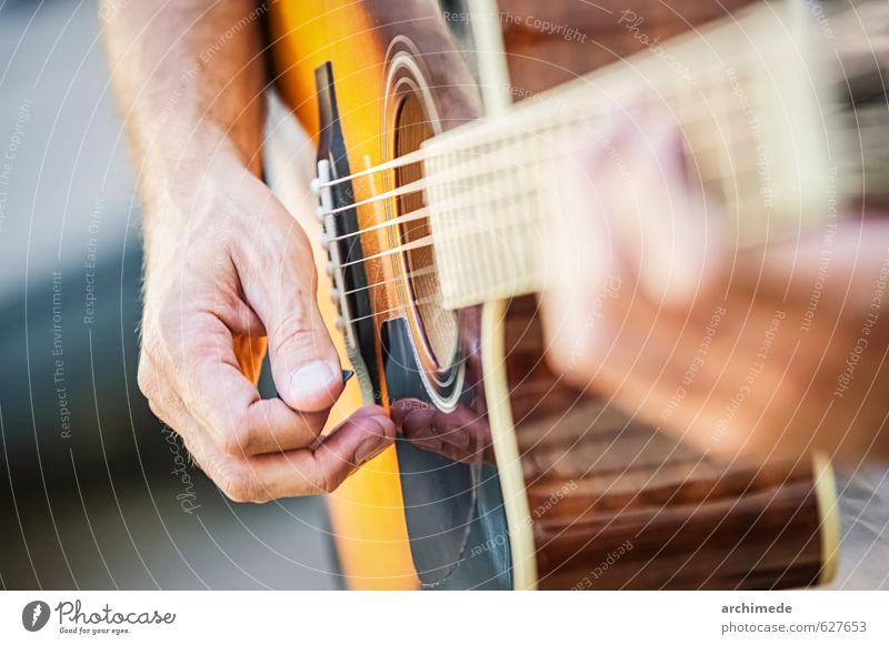 man playing a guitar Playing Music Hand Concert Guitar acousting guitar pick strings music notes people Live country musician country and western Practice