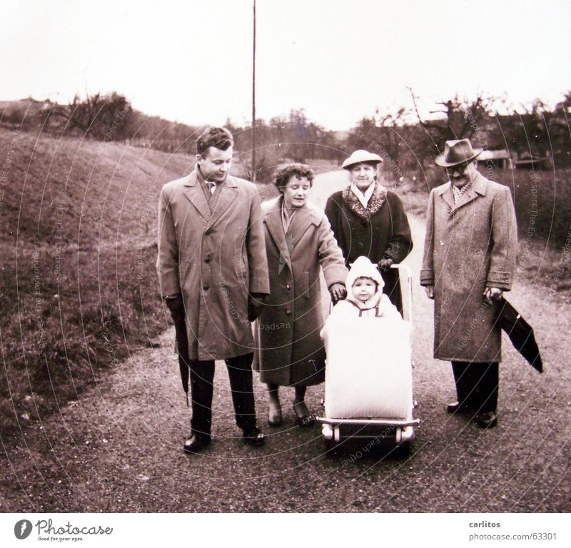 Family photo in a relaxed position The fifties Safety (feeling of) Mother Family outing Baby carriage postwar generation postwar Germany Child Happy