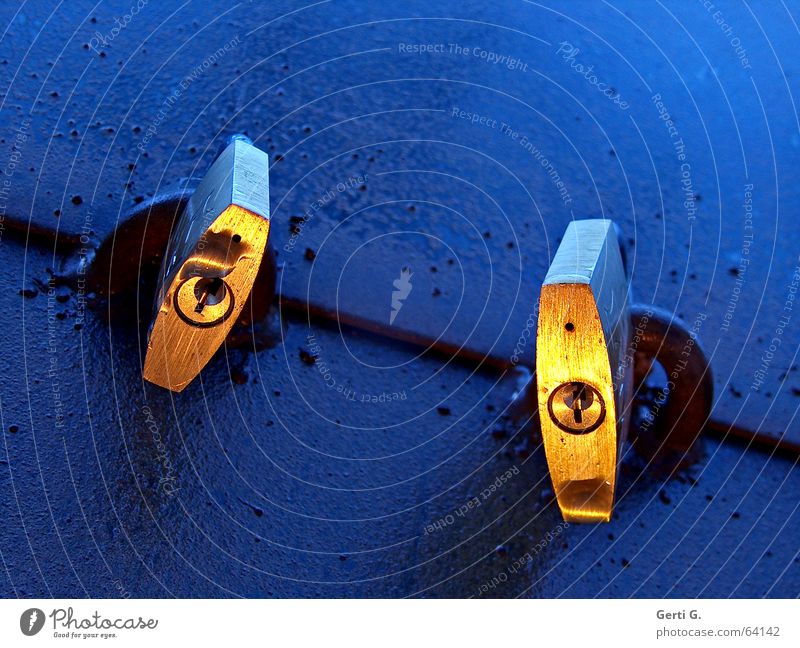 two golden padlocks with keyhole on blue surface Safety Close Closed Padlock Keyhole 2 Together Light Moody Gold Blue Twilight Reduplication In pairs