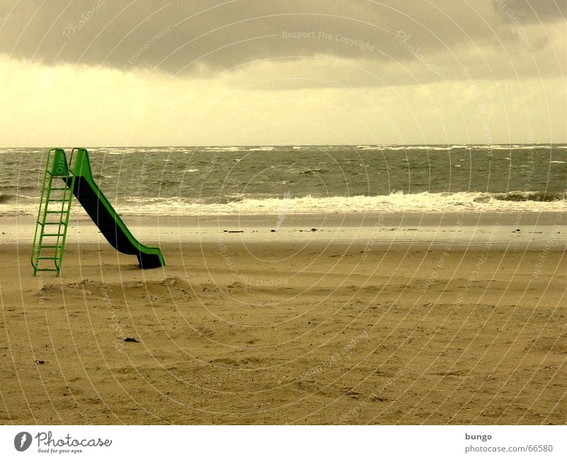 desiderium Langeoog Slide Green Brown Storm Clouds Ocean Lake Waves Beach Sandy beach Vacation & Travel Loneliness Boredom Playground Longing Peace Coast