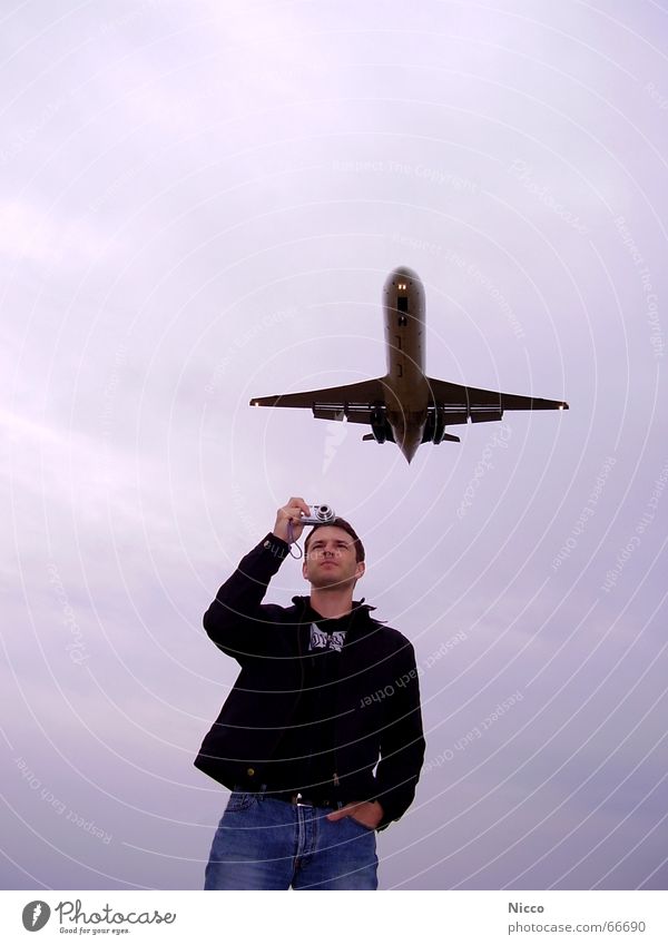 Airplanes in the lens Clouds Photographer Take a photo Bad weather Man Wanderlust Sky Jet Airport Aviation Camera Airplane landing Wait Passenger plane Airbus