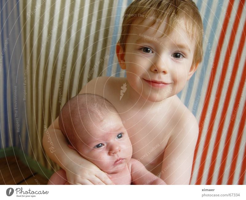 Loving embrace Baby Toddler Child Girl Sister Brother Love Embrace Naked Stripe Wooden floor Safety (feeling of) Brothers and sisters Boy (child) Laughter
