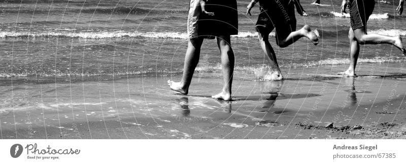 The sea is calling!!! Refrigeration Ocean Beach Refreshment Summer Waves Atlantic Ocean Joy Black & white photo Partially visible run in Water Human being Legs