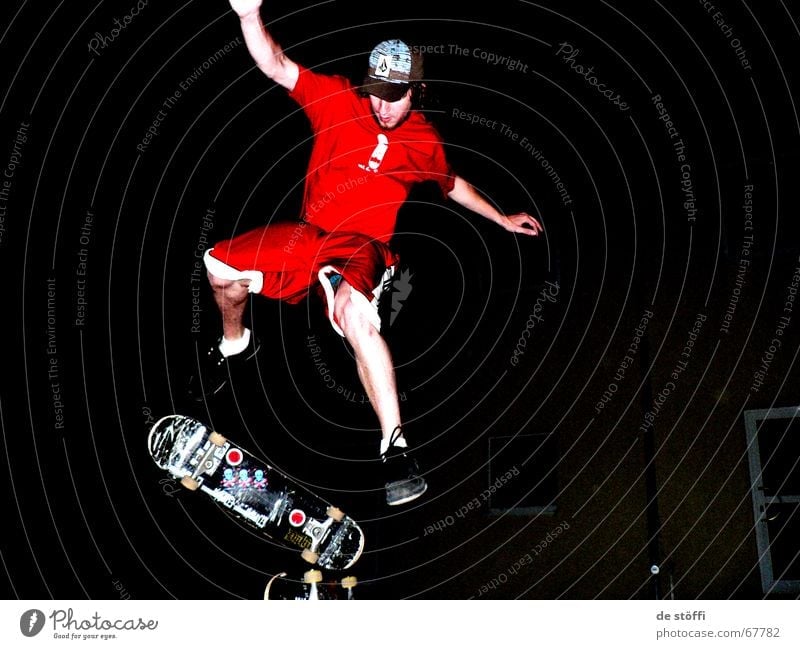 nocturnal active Skateboarding Red Baseball cap Cape Dark Action Jump Fellow Young man Label Night Clothing in midair Legs Musculature Rotate Tall move yeah Joy