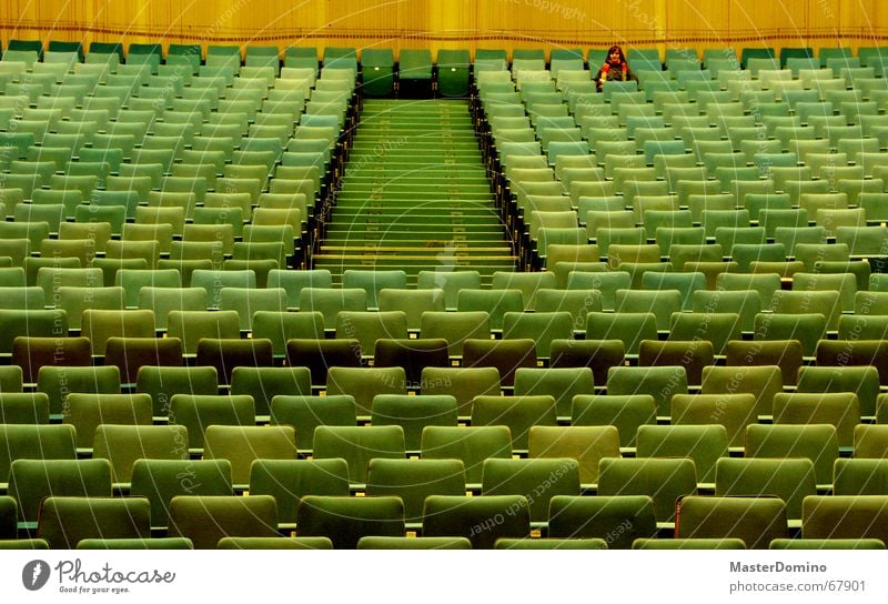 Film over Cinema Movie hall Hall Empty Loneliness Looking Row of seats Armchair Movie theater seat Green Wall (building) Past Interior shot Woman Scarf Sit