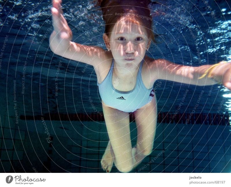 dive Swimming pool Swimming & Bathing Playing Sports Dive Child Blue Swimsuit hold one's breath Nirvana canon yomam Colour photo Underwater photo