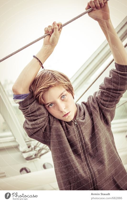 Portrait on a wire Lifestyle Style Beautiful Human being Masculine Youth (Young adults) 1 8 - 13 years Child Infancy Fashion Brunette Observe Touch To hold on