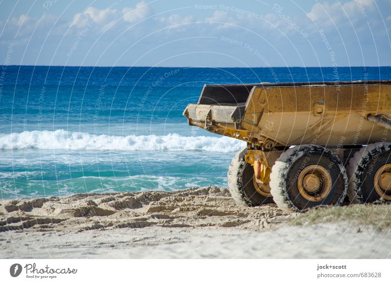 Sand tipper on the sandy beach Construction site Construction machinery Clouds Horizon coast Pacific Ocean Pacific beach Dumper Warmth Moody Fear of the future