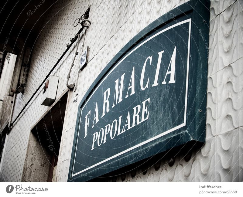 Farmacia Popolare Facade Italy sign pharmacy street insignia building Wall (barrier)