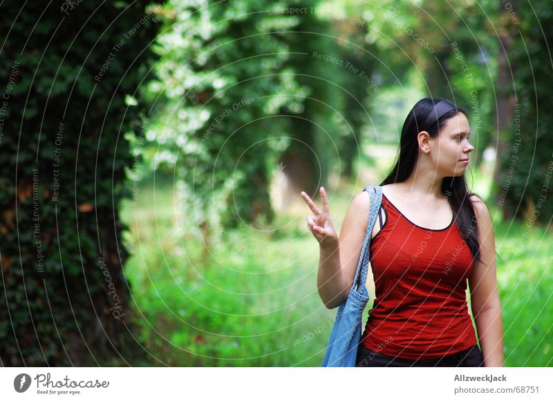 Peace! Avenue Green Woman Happiness Peace-loving Tree Forest Exterior shot Portrait photograph Human being looks to the right two fingers red shirt Nature