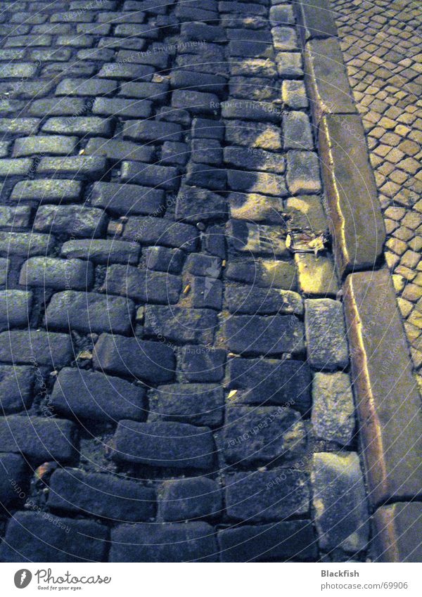 Dark lane Curbside Sidewalk Night Lisbon Portugal Gray Black Romance Resume Pattern Curbstone Street Cobblestones Lanes & trails Fear Paving stone