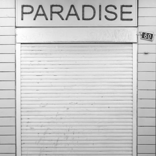 Paradise closed Antwerp Belgium Town Downtown Manmade structures Building Facade Retro Trashy Gloomy Sadness Apocalyptic sentiment Shopping Trade Crisis Fiasco