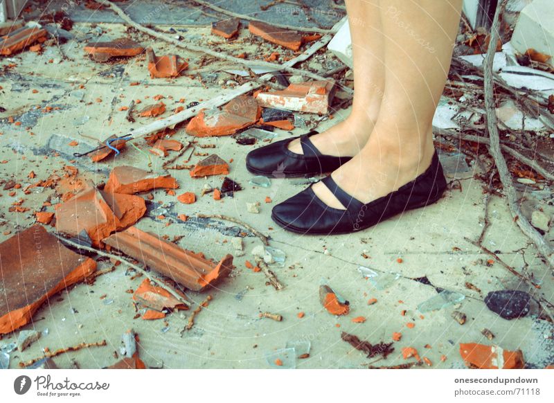 flogged Roofing tile Building rubble Shard Broken Footwear Lady Stand Shank's mare Black Brick Trash Chaos Muddled Destruction destroyed decay shoes legs feet