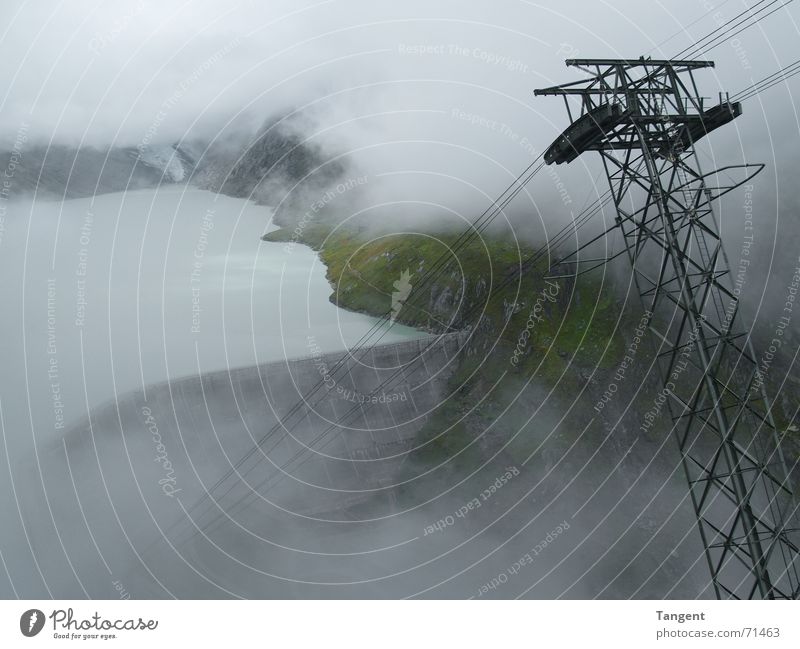 hole in the cloud Clouds Fog Retaining wall Electric Cable car Switzerland Reservoir Lake Waves Edge Rain Wet Damp Mountain Electricity Energy industry Rope