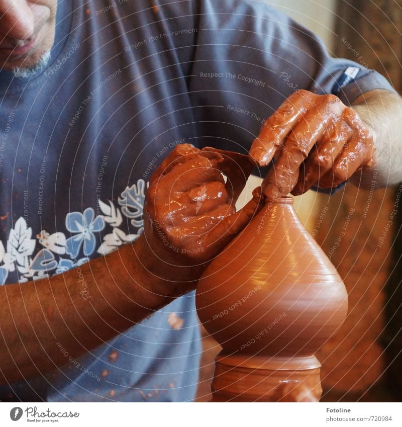 craftsmanship Human being Masculine Man Adults Nose Mouth Hand Fingers Blue Brown Pottery Do pottery Clay Colour photo Multicoloured Day Light