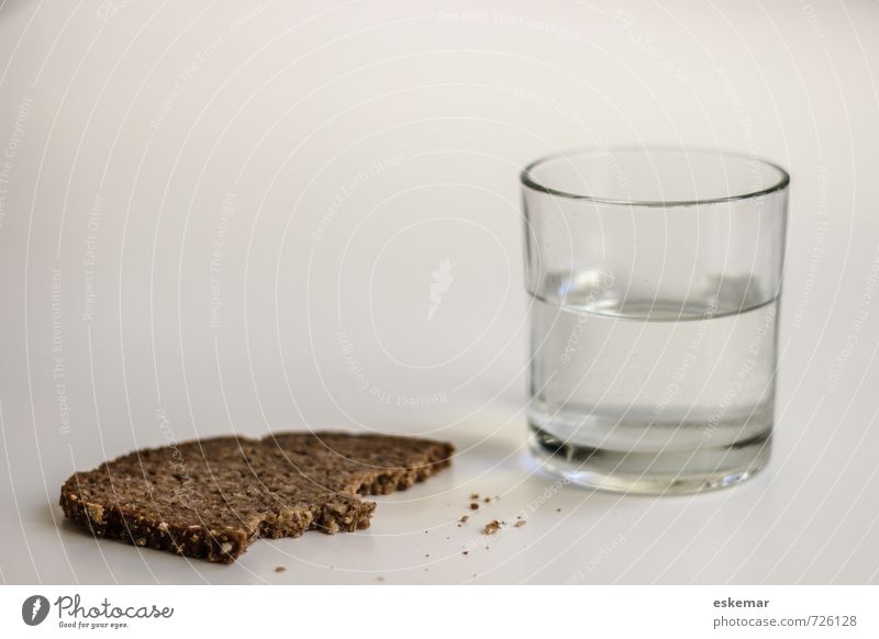 Water and bread Food Dough Baked goods Bread Nutrition Vegetarian diet Diet Beverage Drinking water Glass Poverty Esthetic Authentic Simple Cheap Gloomy Dry