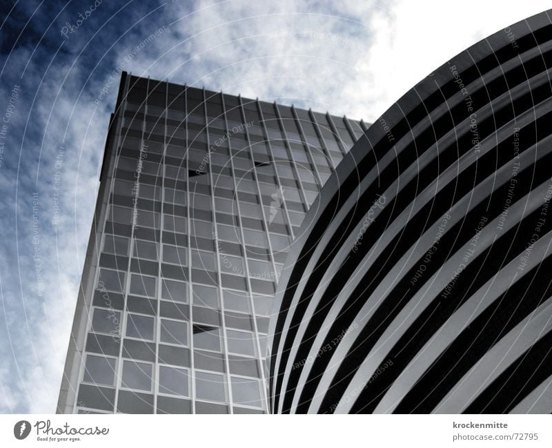 Cuboid and column Clouds House (Residential Structure) Building Window Reflection Large Glas facade Towering Height difference Sky Tall office building to tower