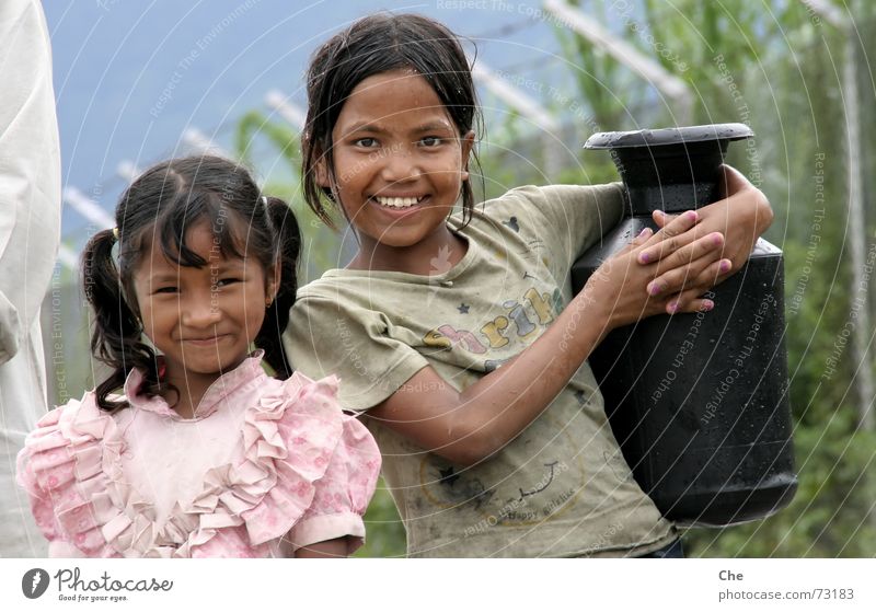 Small water carriers Water jug Nepal Child Friendship Brothers and sisters Sister Wet Chic Beautiful Dirty Heavy Asia Household Laughter Work and employment