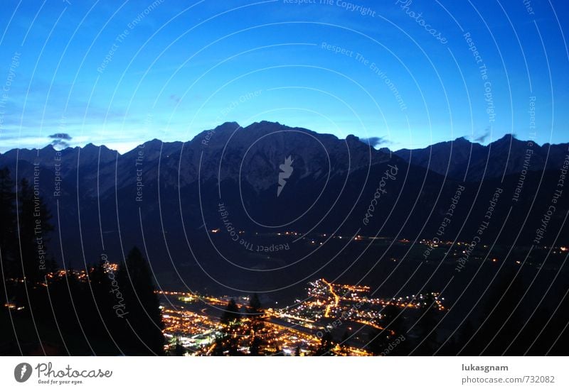 Innsbruck by night Nature Landscape Night sky Meadow Field Forest Rock Alps Mountain Adventure Colour photo Exterior shot Experimental Deserted Copy Space left