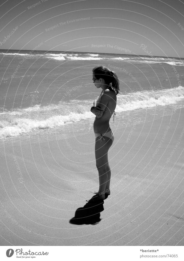 alone? Hair and hairstyles Sunglasses Bikini Beach Vacation & Travel Ocean Wet Cold Waves Sand Water Shadow Black & white photo