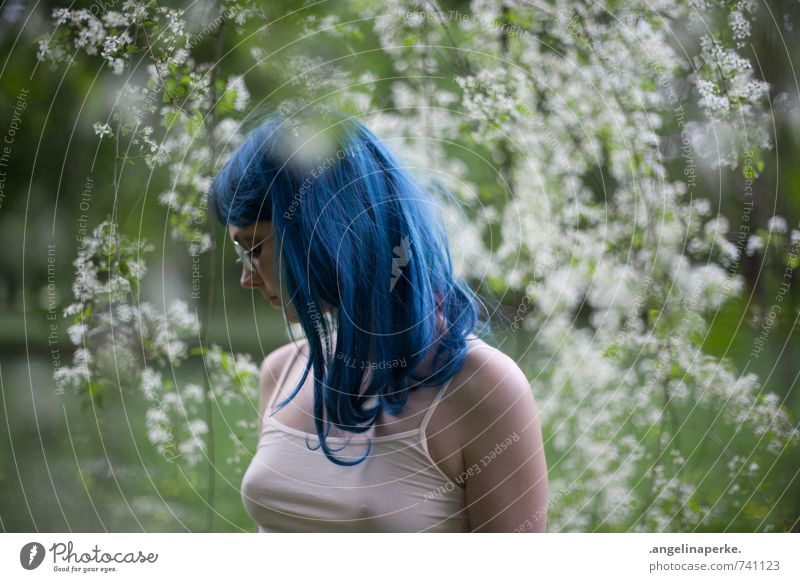 Woman with blue hair stands in profile under tree with white flowers, Nature Summer Beautiful weather Plant Tree Blossom Park Forest Sunglasses Wig Fresh pretty
