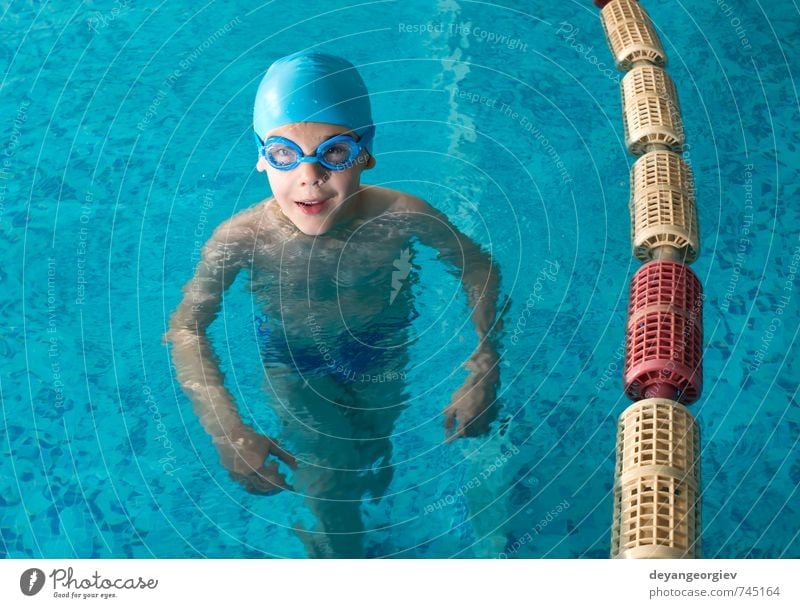 Little boy in swimming pool Joy Happy Leisure and hobbies Playing Vacation & Travel Summer Sports Swimming pool Child School Boy (child) Infancy Smiling