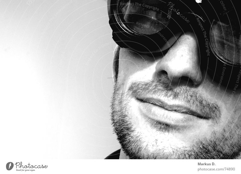 sky captain Black White Eyeglasses Welding goggles Man Style Portrait photograph Overexposure Serene Impish Interior shot Facial hair Designer stubble Unshaven
