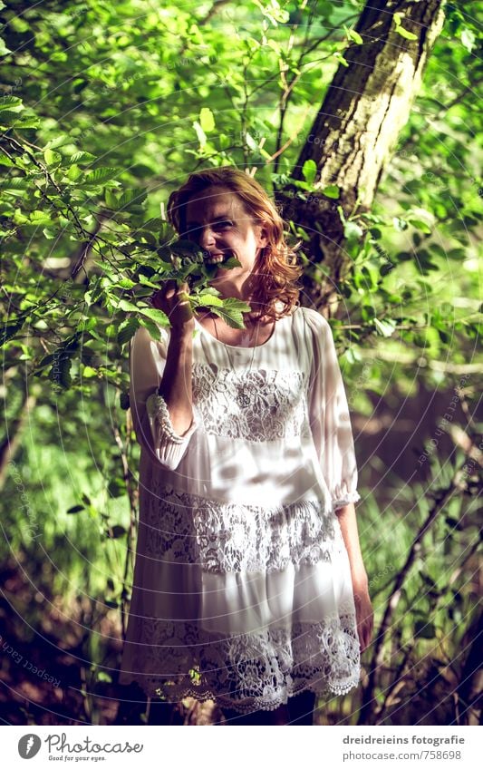 I'm hungry, so I bite the leaves. Joy Happy Human being Feminine Young woman Youth (Young adults) 1 Nature Plant Beautiful weather Fashion Dress Touch
