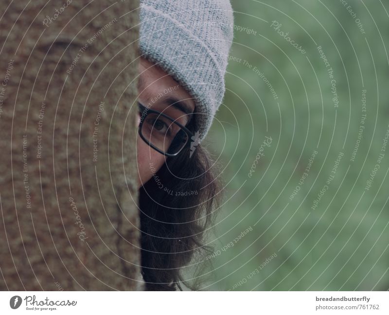game of hide-and-seek Playing Human being Masculine Young man Youth (Young adults) 1 18 - 30 years Adults Forest Eyeglasses Cap Brunette Long-haired Observe