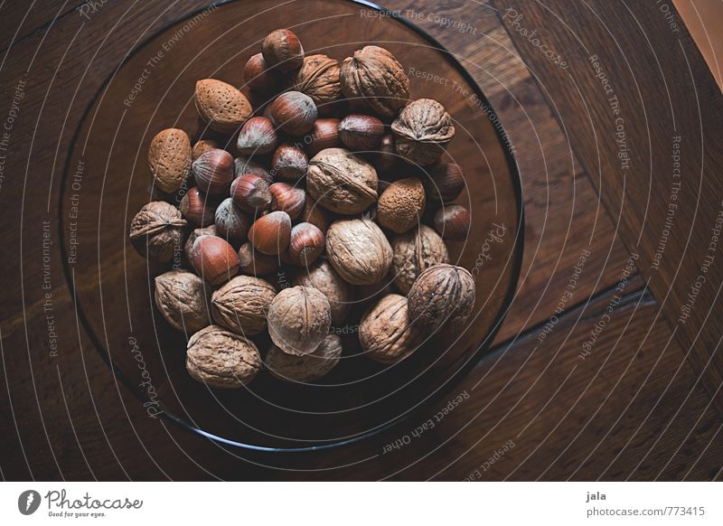 nuts Food Nut Walnut Hazelnut Nutrition Organic produce Vegetarian diet Bowl Healthy Eating Simple Delicious Natural Wooden table Colour photo Interior shot