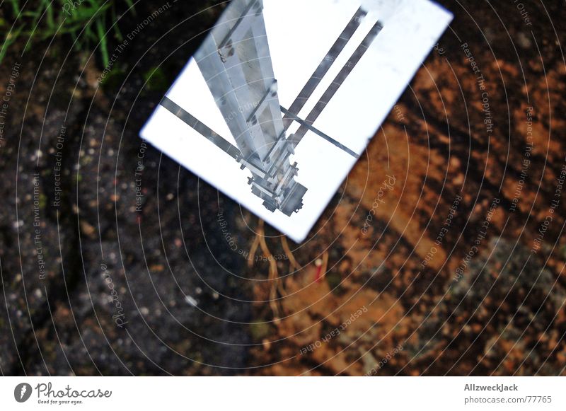 mirror image Mirror Mirror image Asphalt Invalided out Exterior shot Trash Throw away Steel Electricity Electricity pylon Cable Sky Floor covering
