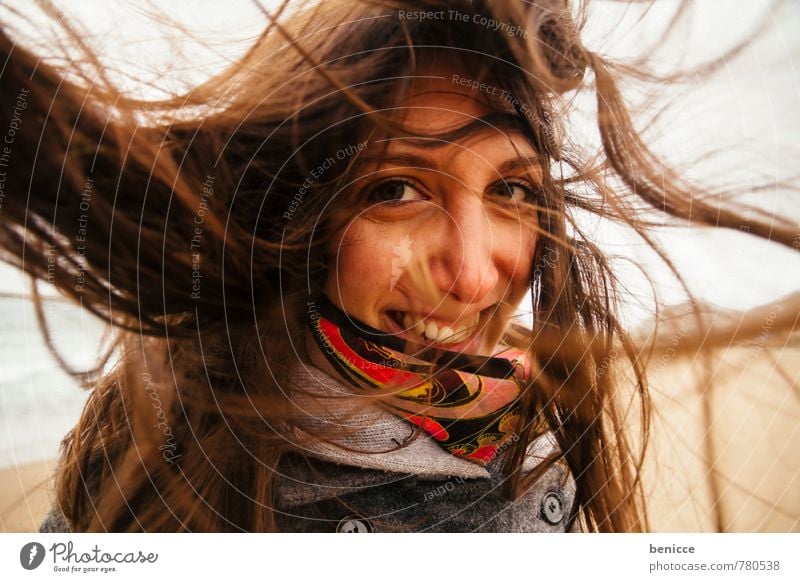 Woman with wind in her hair on the beach Human being Hair and hairstyles Wind Blown away Scarf Smiling Looking into the camera Beach Winter Autumn Grinning