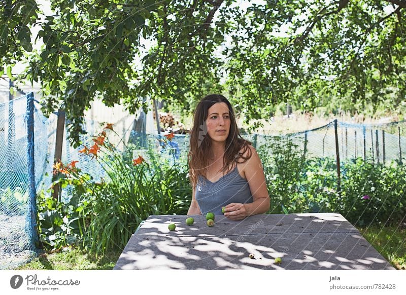 Under the apple tree Apple Table Human being Feminine Woman Adults 1 30 - 45 years Nature Plant Sunlight Summer Beautiful weather Tree Flower Bushes Garden